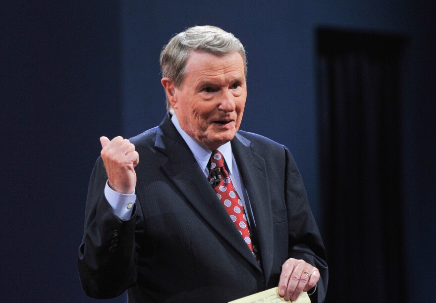Jim Lehrer, of the PBS Newshour, speaks to the audience before moderating the first presidential debate.
