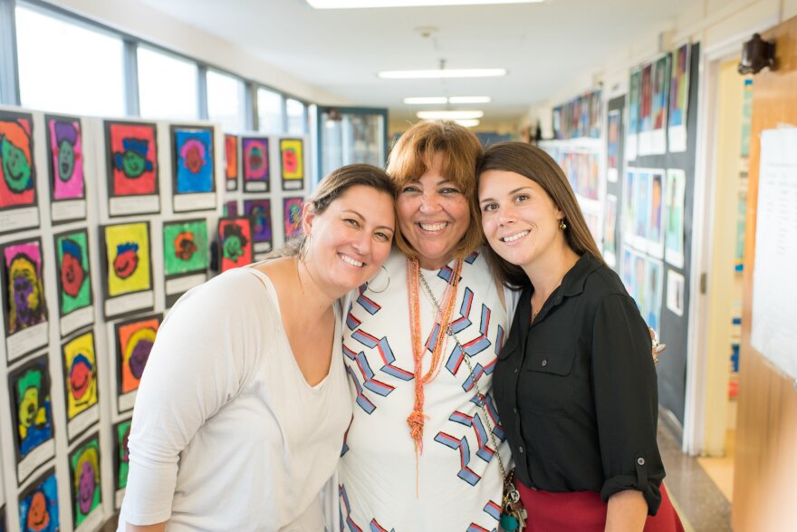 Arts specialist Cathryn Deering, principal Akida Kissane Long and teacher Charlotte Borgen at the school's portrait night.