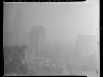 A view of part of the Civic Center on January 6, 1948, "when the eye-smarting smog was at its worst." The picture was taken from First and Olive Streets. 