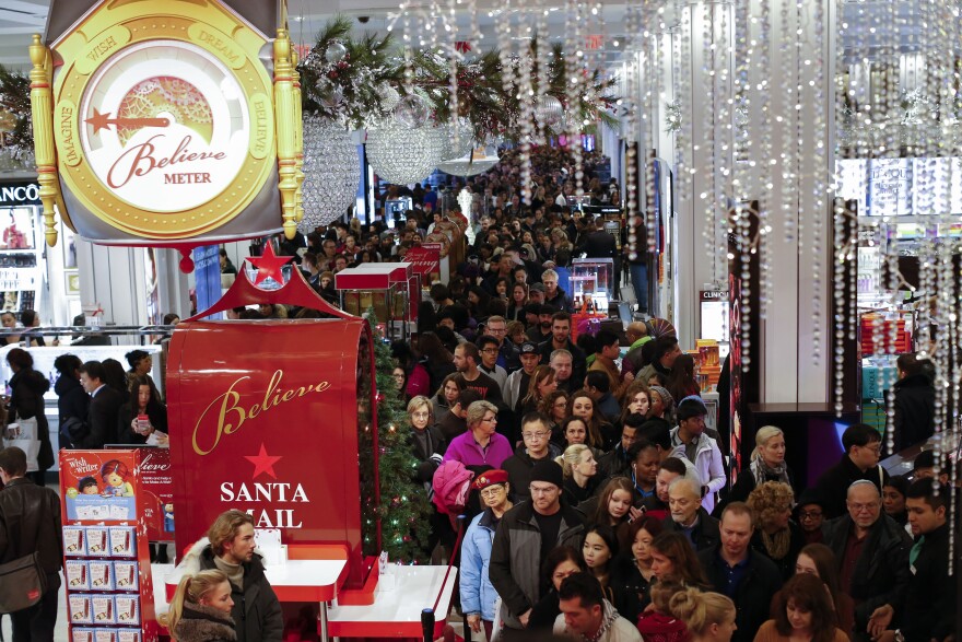 NEW YORK, NY - NOVEMBER 26: Customers stream into Macy's flagship store in Herald Square on Thanksgiving evening for early Black Friday sales on November 26, 2015 in New York City. Security has been heightened in Herald Square and around the city as thousands of shoppers flock to stores for sales on the kickoff to the Christmas shopping season. (Photo by Kena Betancur/Getty Images)