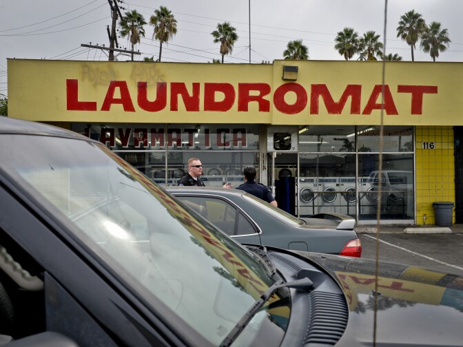 Anaheim Police Department CPT officers near a laundromat in the Guinida Lane neighborhood of Anaheim Thursday.

Anaheim Police Department CPT division on patrol in Anaheim Thursday January 29th, 2014. The CPT division engages communities to reduce crime and build relationships with citizens to improve the community.Anaheim Police Department CPT division on patrol in Anaheim Thursday January 29th, 2014. The CPT division engages communities to reduce crime and build relationships with citizens to improve the community. 

