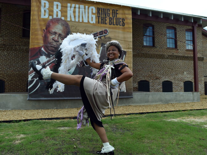 A woman dances outside the B.B. King Museum and Delta Interpretive Center during a public wake for blues legend B.B. King in Indianola, Mississippi, on May 29, 2015. Hundreds of fans gathered to pay their respect to King, who died on May 14 at the age of 89 in Las Vegas.