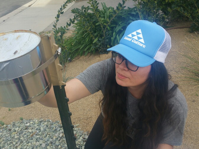 UC Berkeley PhD student Diane Garcia-Gonzales takes readings from a monitor placed in the front yard of a Porter Ranch home on Jan. 29th, 2016. Garcia-Gonzales is one of the students volunteers helping UCLA Environmental Health Scientist, Michael Jerrett, take independent air samples at the site of the Southern California Gas Company leak at its Aliso Canyon Storage Facility.  