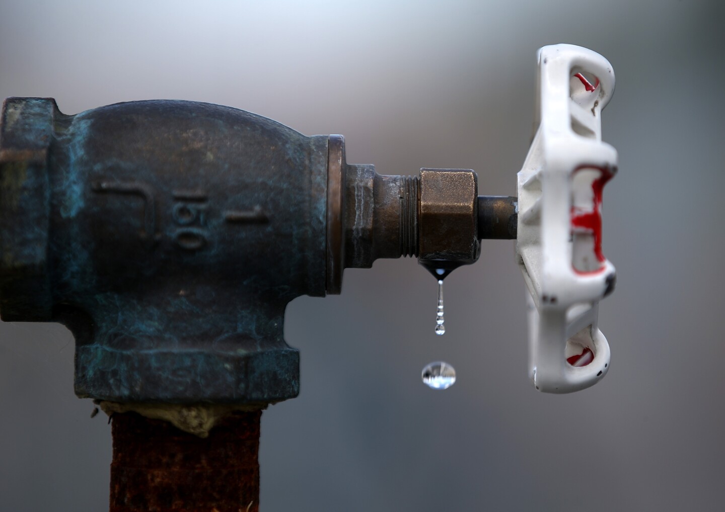 Water drips from a faucet at the Dublin San Ramon Services District (DSRSD) residential recycled water fill station on April 8, 2015 in Pleasanton, California.  
