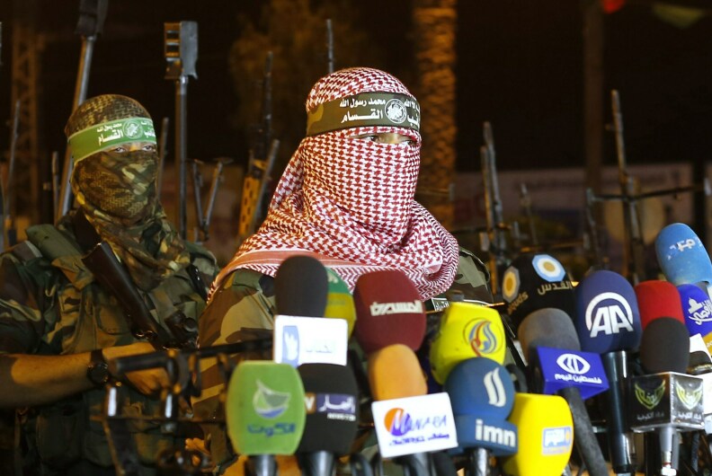 A person identifying as Abu Obeida delivers a statement in July 2015.