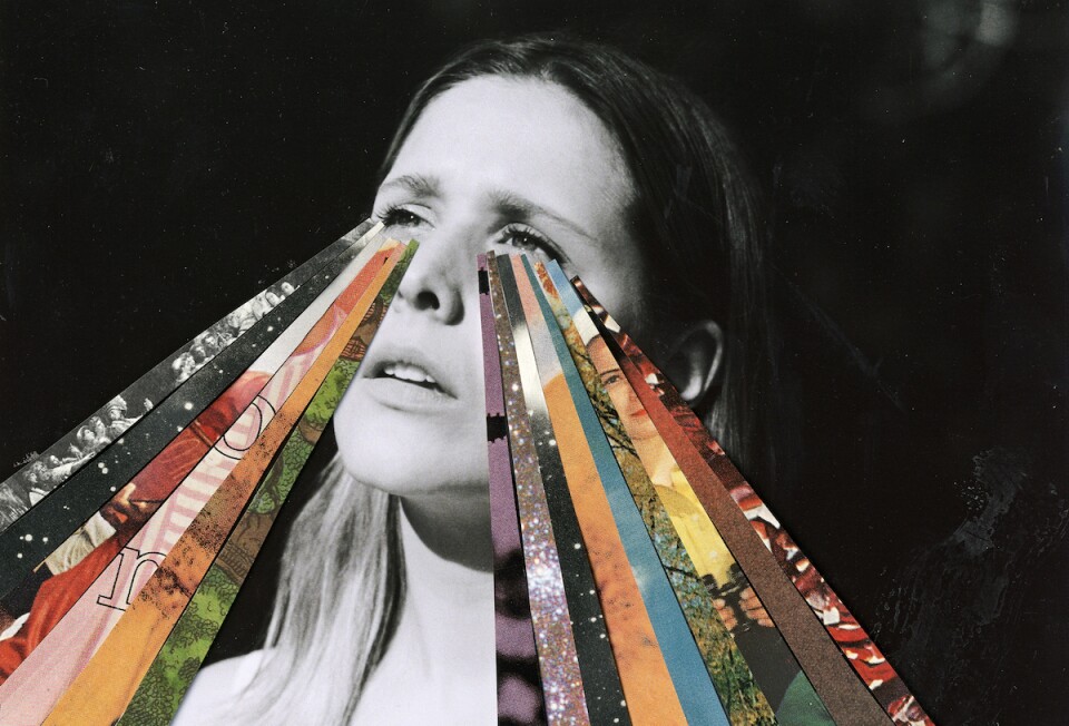 a black and white photo of a woman with colorful streaks shooting out of her eyes