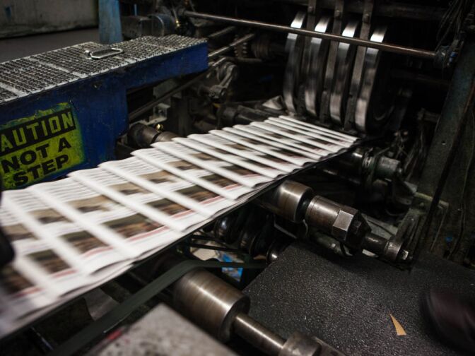 Copies of the Orange County Register slide through the presses. The newspaper is the country’s 20th most-read daily, with a circulation of about 285,000.