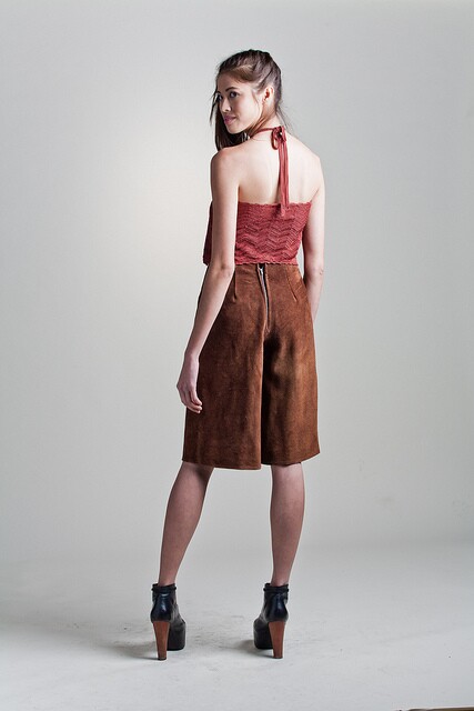 A model wears brown suede culottes