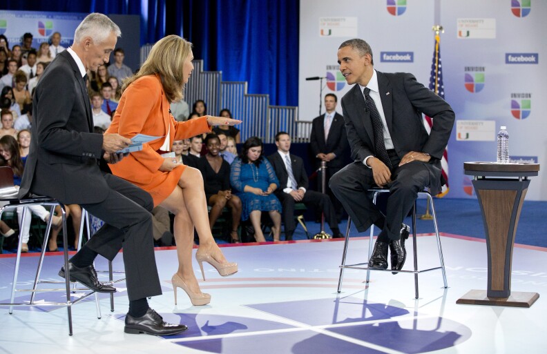 President Barack Obama participates in a town hall hosted by Univision and Univision news anchors Jorge Ramos, left and Maria Elena Salinas, center, at the University of Miami, Thursday, Sept. 20, 2012, in Coral Gables, Fla.  