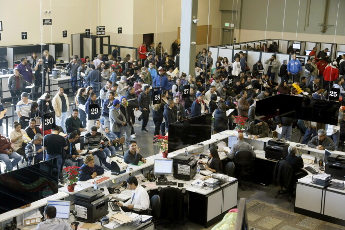 Hundreds of immigrants line up at a California Department of Motor Vehicles office to register for drivers licenses in Stanton, on Jan. 2, 2015, the first day California began issuing driver’s licenses to the nation’s largest population of immigrants in the country illegally. 