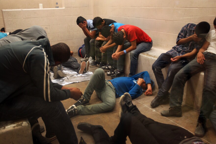 Immigrants who have been caught crossing the border illegally are housed inside the McAllen Border Patrol Station in McAllen, Texas where they are processed on July 15, 2014 in McAllen, Texas.  The detainees are both men and women, and range in age from infants to adults, where more than 350 were being held.  Detainees are mostly separated by gender and age, except for infants.  More than 57,000 unaccompanied children have been apprehended at the southwestern border since October, more than twice the total this time last year, many through the Rio Grande Valley. Many are fleeing growing violence in Central America.  