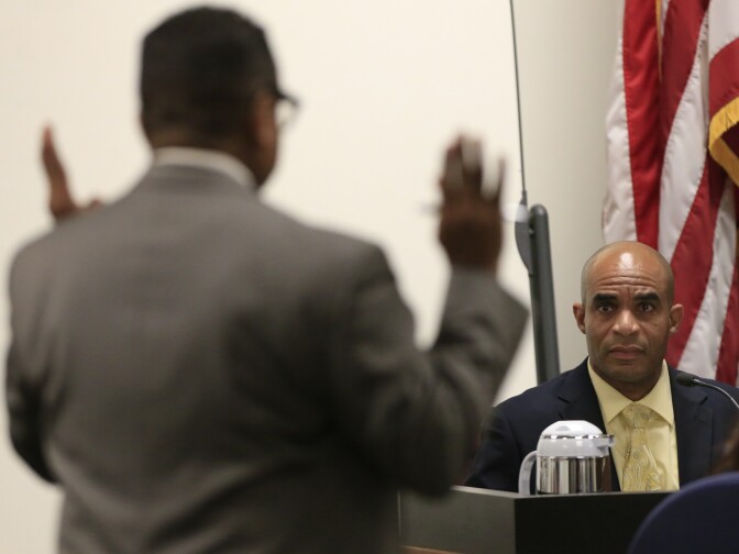 Defense Attorney Kenneth Alan Reed (left) questions Santa Ana Police Detective Matthew Mcleod (right) during the first day of a  preliminary hearing for Candace Marie Brito and Vanesa Zavala in the West Justice Center on February 10, 2014 in Westminster, California. The two women are facing charges in the beating death of Kim Pham in front of a Santa Ana nightclub. 