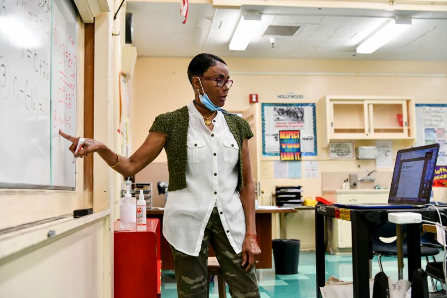 LOS ANGELES, CALIFORNIA - SEPTEMBER 08: Hollywood High Special Education teacher Shirley Woods conducts class remotely on September 08, 2020 in Los Angeles, California. LAUSD school campuses remain closed during the COVID-19 pandemic, however many teachers are opting to broadcast lessons virtually from their empty classrooms. School days run from 9am-2:15pm, and includes “asynchronous” live instruction - students working on their own time, pre-recorded instruction, and self-guided modules. (Photo by Rodin Eckenroth/Getty Images)