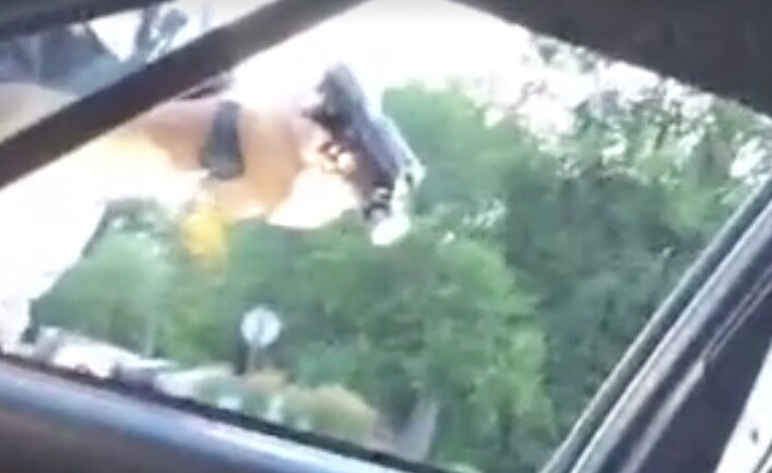Minnesota police officer with his gun drawn after shooting Philando Castile.