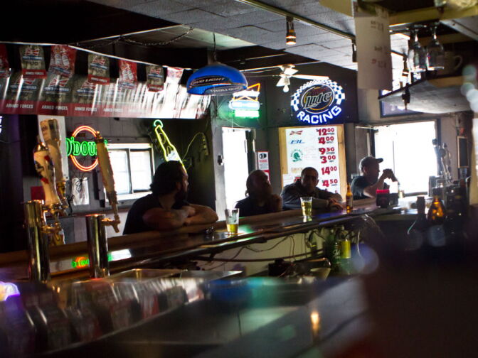 Customers sit in bar at the King Eddy Saloon in Downtown Los Angeles. The bar will temporarily close down for renovations after the summer this year. 