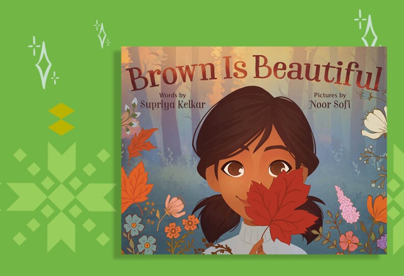 A book cover shows a girl with medium skin tone and hair in pig tails holding up a rust-colored autumn leaf. She is surrounded by pink, orange and teal flowers and more fall leaves. The title reads Brown Is Beautiful.