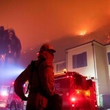 Firefighters establish a perimeter during the Getty fire.