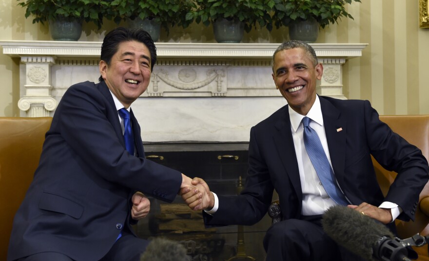 President Barack Obama shakes hands with Japanese Prime Minister Shinzo Abe during their meeting in the Oval Office of the White House in Washington, Tuesday, April 28, 2015.  (AP Photo/Susan Walsh)