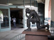SAN BERNARDINO, CA - JULY 12:  A memorial to fallen police officers stands at the entrance to the City of San Bernardino Police Department on July 12, 2012 in San Bernardino, California. The San Bernardino City Council voted this week to file for Chapter 9 bankruptcy protection, making San Bernardino the second largest municipality in the nation ever to file for bankruptcy and the third in California to opt for bankruptcy in the past two weeks. Stockton, California with a population of nearly 300,000, became the biggest when it filed for bankruptcy on July 3. The Sierra Nevada Mountains ski town of Mammoth Lakes, California also voted for bankruptcy July 3. The city is facing a $45.8 million budget shortfall and is in danger of not making payroll for the next three months. City officials are set to discuss the next steps in the bankruptcy process and may also declare a fiscal emergency at its meeting July 16.  (Photo by David McNew/Getty Images)