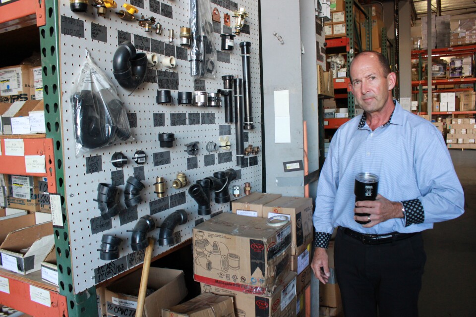 20/20 Plumbing and Heating vice president Mike Mahony walks through the company’s warehouse, October 16, 2019. 
