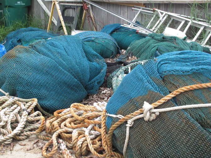 Bundles of nets lay untouched in Erwin "Bubba" Menesses Jr.'s yard in St. Bernard Parish, La.  Because of the oil spill, he's only made one new net this year.