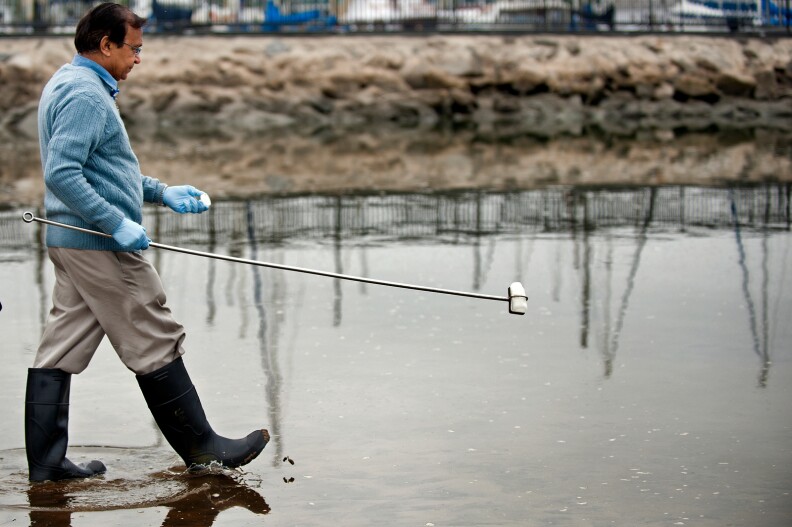 Lab Technician Pravin Patel takes four different samples from four different areas of Mother's Beach in Marina del Rey. Patel and other Environmental Monitoring Division technicians test the water from Long Beach to Malibu.