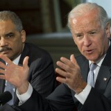 US Vice President Joe Biden speaks alongside Attorney General Eric Holder (L) as he meets with representatives of victims’ groups and gun safety organizations at the Eisenhower Executive Office Building adjacent to the White House in Washington, DC, on January 9, 2013. The meeting comes as US President Barack Obama's administration works to develop gun policy proposals following last month's mass shooting in Newtown, Connecticut.
