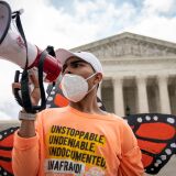 WASHINGTON, DC - JUNE 18: Roberto Martinez, a DACA recipient, chants and cheers following the Supreme Court's decision regarding the Trump administration's attempt to end DACA outside the U.S. Supreme Court on June 18, 2020 in Washington, DC. On Thursday morning, the Supreme Court, in a 5-4 decision, denied the Trump administration's attempt to end DACA, the Deferred Action for Childhood Arrivals program. (Photo by Drew Angerer/Getty Images)