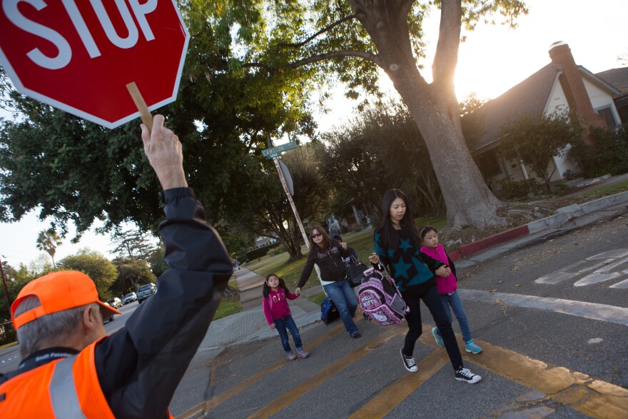 Crossing guard Tony Abdalla ensures children's safety outside of Arroyo Vista Elementary School in South Pasadena.