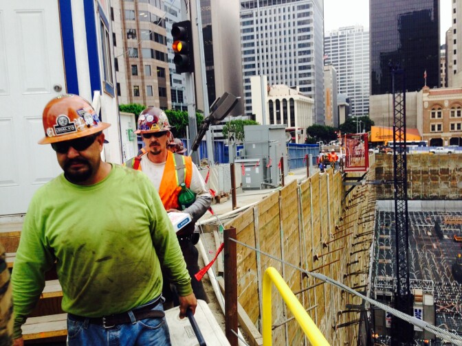 Workers use an elevator to enter and exit the city-block sized pit. In some areas the hole is 120 feet below ground level.