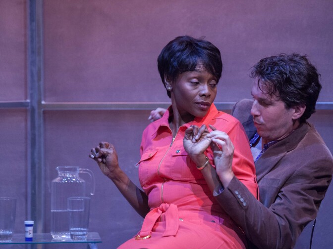 Inger Tudor (left) and James Liebman in a scene showing "driscotol," an invented drug that cures racism.