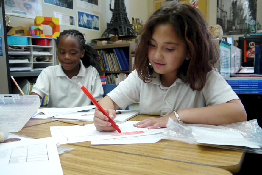 Kourtney (left) and Gina (right) work on sketching ideas for their sculptures in Ms. Grotts third grade class in Pasadena.