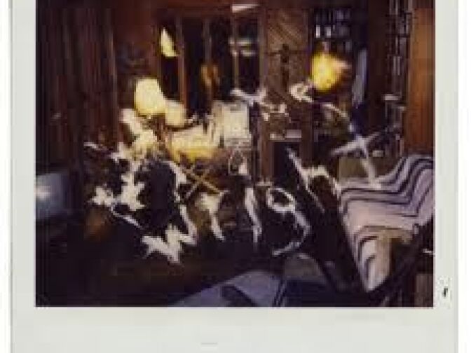 One of the "ghost writer" Polaroids snapped inside a home in Glassel Park spells out a message. 