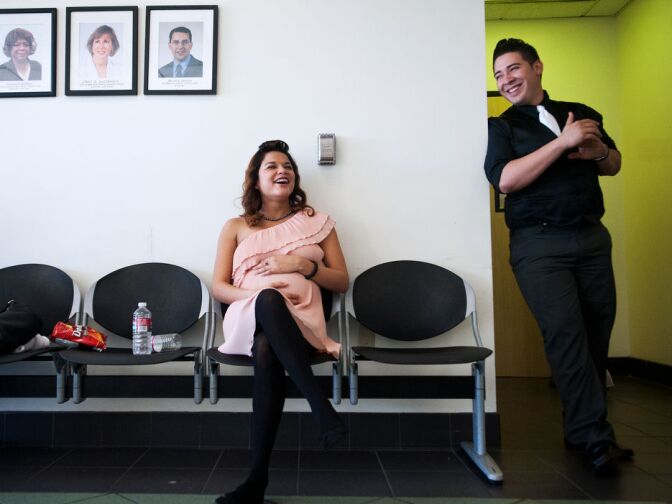 Jessica and Rick Garcia wait to be married on Monday afternoon. Garcia, right, is in the National Guard. The couple met as friends in high school.
