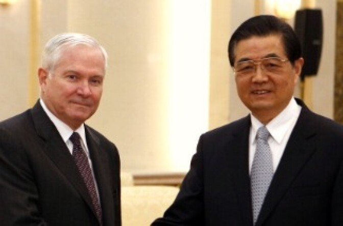 U.S. Secretary of Defense Robert Gates shakes hands with China's President Hu Jintao at the Great Hall of the People in Beijing, China.  