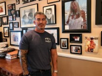 Paul Wilson stands next to a photo of his late wife, Christy Wilson (in white) on Aug. 17, 2017. Christy Wilson was one of eight victims of a 2011 shooting at a beauty salon in Seal Beach. An Orange County judge will decide on Aug. 18 whether the state can pursue the death penalty against confessed shooter Scott Dekraai.  