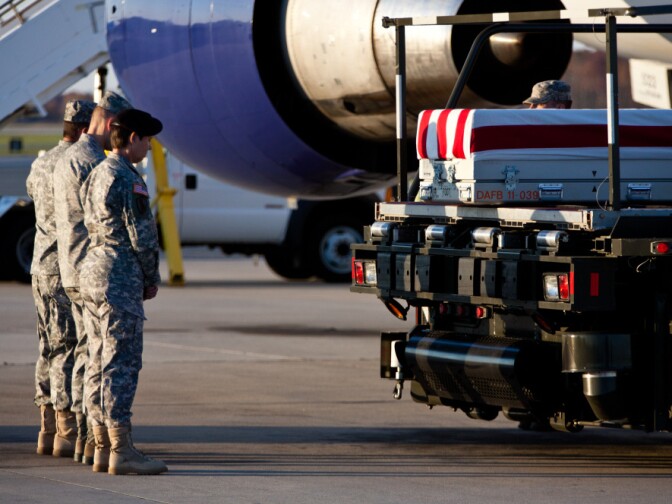 The remains of a U.S. Army private arrive at Dover Air Force Base for a transfer ceremony last November. The mortuary at Dover Air Force Base has come under accusations that body parts of the nation's war dead were cremated and the ashes dumped in a Virginia landfill.