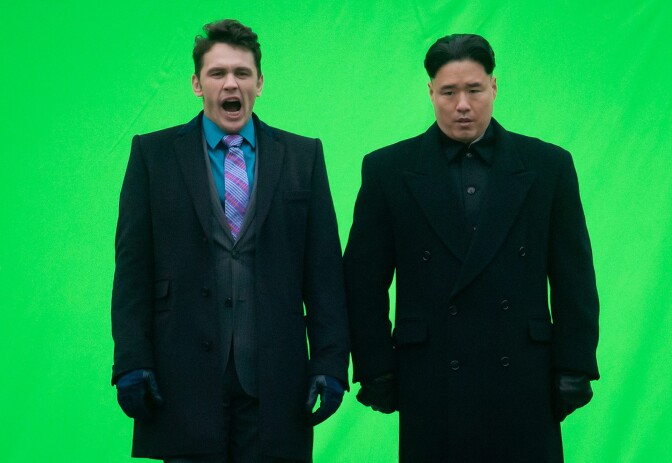 In this Nov. 29, 2013 file photo, actor James Franco, left, yawns before filming a scene with an actor playing North Korean leader Kim Jong Un for the movie "The Interview," at Robson Square in Vancouver, British Columbia. The square has been transformed into a North Korean set complete with North Korea statues and soldiers. North Korea is declaring that the upcoming release of the comedy film, which features a plot to assassinate Kim Jong Un, would be an act of war. (AP Photo/The Canadian Press, Darryl Dyck, File)
