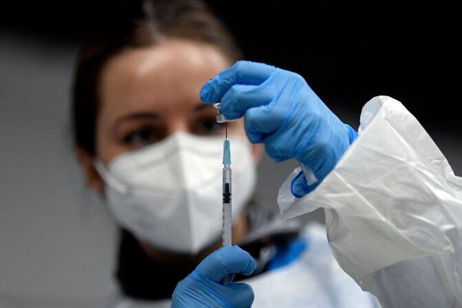 A health worker prepares a Pfizer-BioNTech COVID-19 vaccine during a vaccination campaign of members of the Emergency Medical Services of Madrid (SUMMA) in Madrid on January 12, 2021. - Spain's regions are stepping up virus restrictions but the government remains adamant it would not impose a lockdown despite an expected post-Christmas surge in infections. (Photo by OSCAR DEL POZO / AFP) (Photo by OSCAR DEL POZO/AFP via Getty Images)