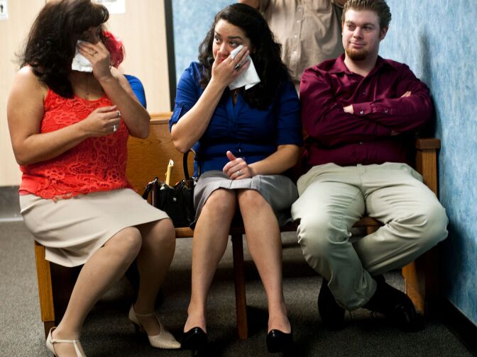 Mother Joan Hernandez and sister Elisa Monique Serna cry after Jessica Garcia's wedding ceremony.