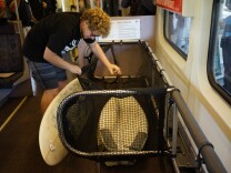 As of June 10, 2017, passengers can bring their surfboards aboard specially outfitted Metrolink train cars.