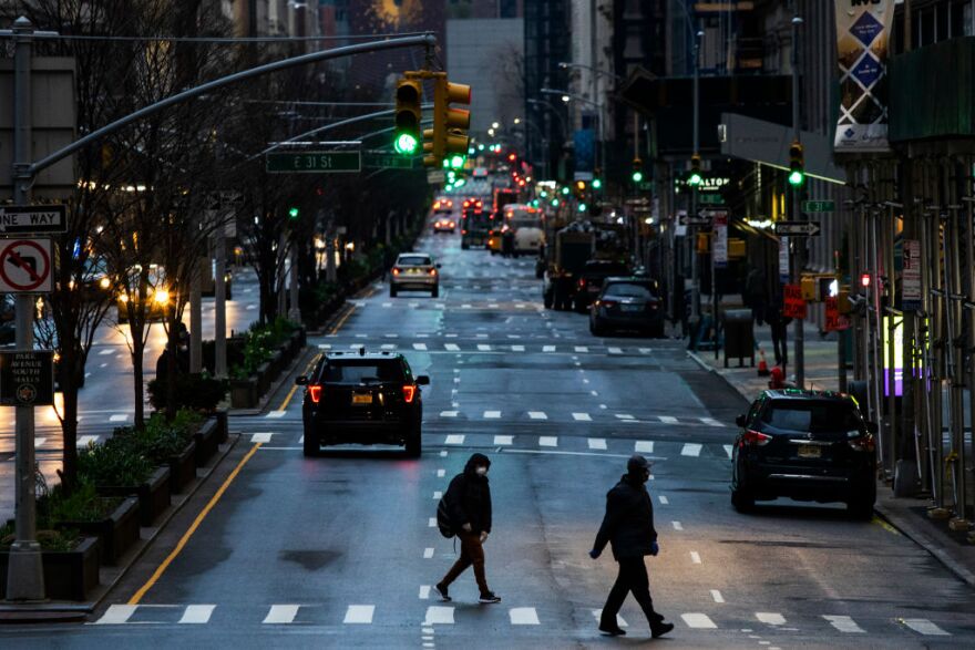 NEW YORK, NY - MARCH 27: People cross Park Av. after it was announced that some streets will be shut as lockdown continues in response to the coronavirus (COVID-19) outbreakon March 27, 2020 in New York City. Mayor Bill de Blasio chose four streets across four boroughs to test whether shutting down streets to vehicular traffic would increase social distancing among pedestrians during the COVID-19 pandemic shutdown. (Photo by Eduardo Munoz Alvarez/Getty Images)