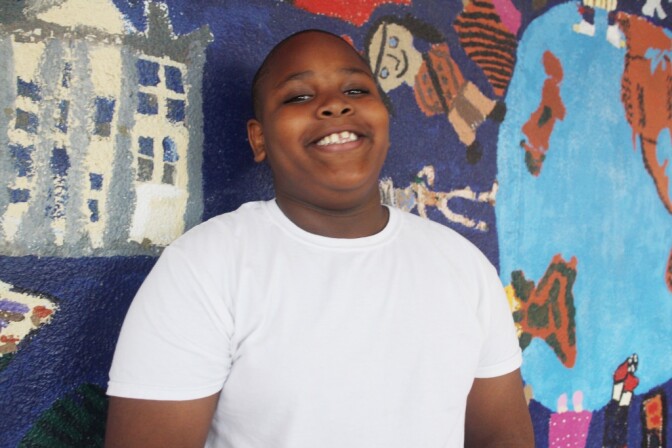 Third grader Jesine says he used to be afraid of talking in class, but now has learned to project his voice and looks forward to being in a play or giving a speech one day.