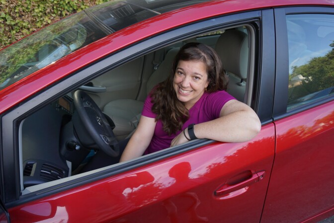 KPCC listener Luisa Rebull sits in her car.