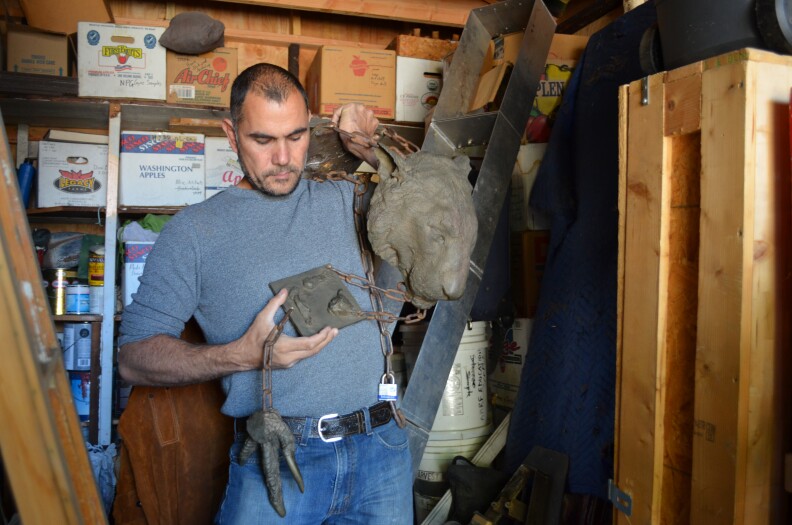 Marcus Eriksen displays a sculpture he made from castings of animals at the L.A. Zoo.