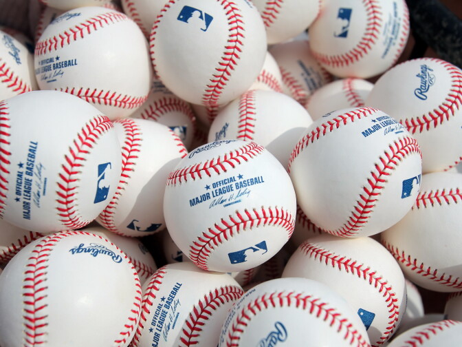 DENVER - APRIL 10:  Baseballs are at the ready for warm ups as the Philadelphia Phillies face the Colorado Rockies during MLB action on Opening Day at Coors Field on April 10, 2009 in Denver, Colorado.  (Photo by Doug Pensinger/Getty Images)