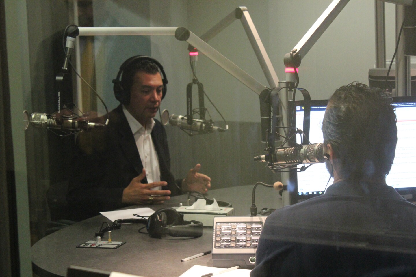 California Secretary of State Alex Padilla talks to A. Martinez. 