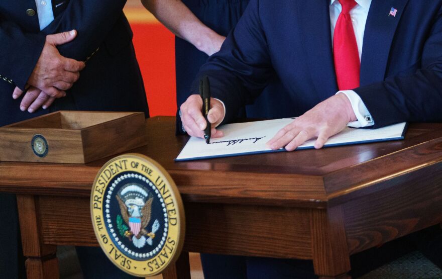 US President Donald Trump signs an executive order on "improving price and quality transparency in healthcare" in the Grand Foyer of the White House in Washington, DC on June 24, 2019. (Photo by MANDEL NGAN / AFP)        (Photo credit should read MANDEL NGAN/AFP/Getty Images)