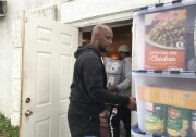Pastor Darryl Jackson unloads boxes of donated food at Love Chapel in Ontario, Jan. 15 2019 (David Wagner/KPCC).
