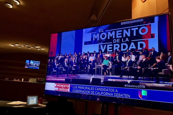 A TV screen shows the gubernatorial debate at UCLA on January 25.